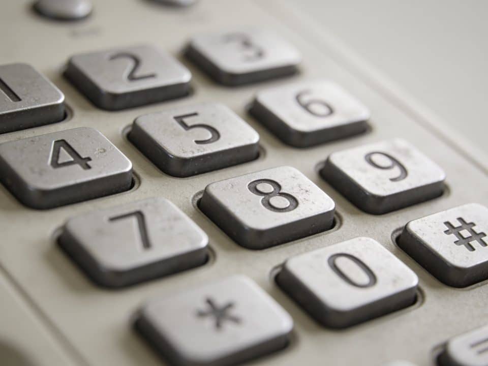 Telephone keypad displaying sequence of numbers clearly visible